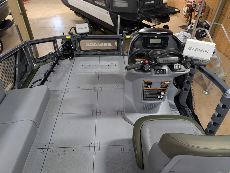 Slide: The Image of Interior view of a 2026 Sea-Doo Switch Fish Compact with helm console and Garmin device. - 6