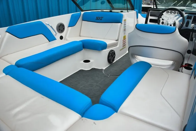 Slide: The Image of Interior of a 2016 MasterCraft NXT20 with blue and white seating. - 6