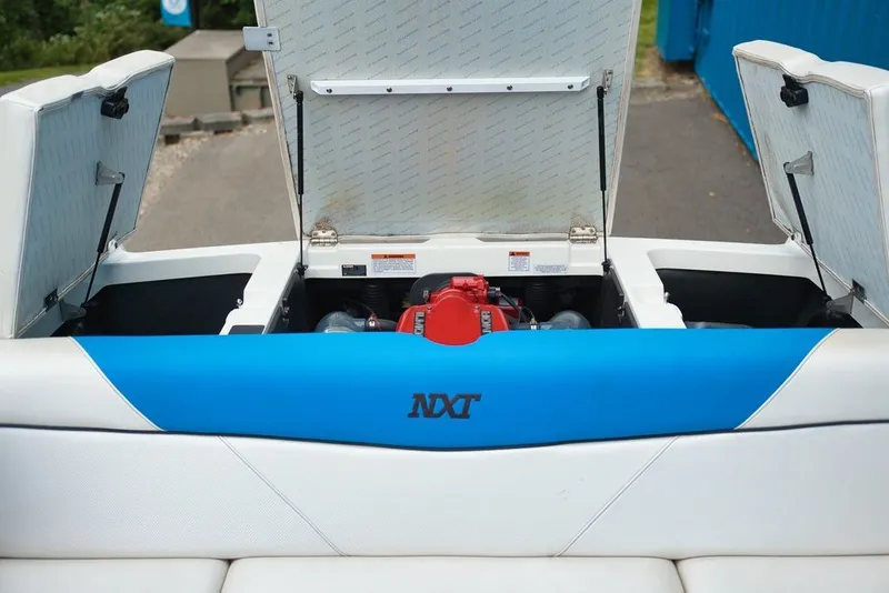 Slide: The Image of Engine compartment of a 2016 MasterCraft NXT20 with blue upholstery. - 11