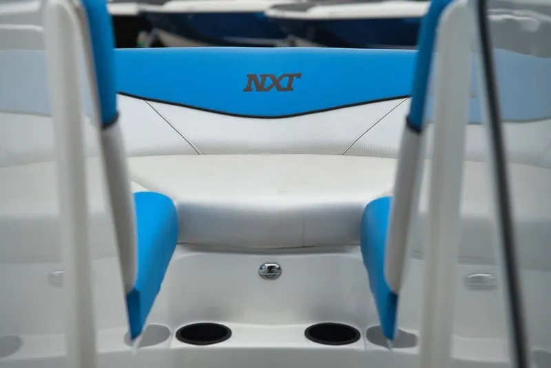 Slide: The Image of The image shows the interior of a MasterCraft NXT20 boat with blue and white seating. - 9