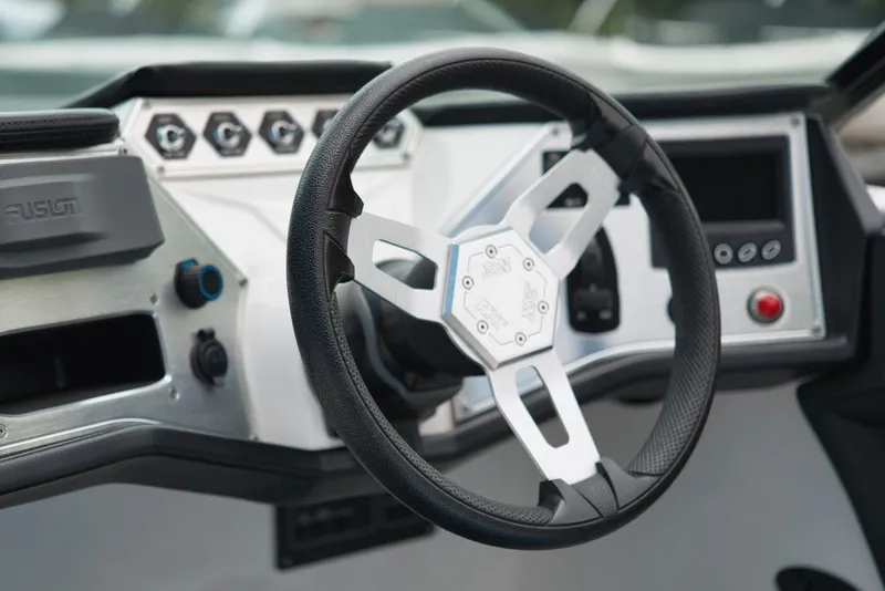 Slide: The Image of The image shows the helm of a 2016 MasterCraft NXT20 with modern controls. - 12