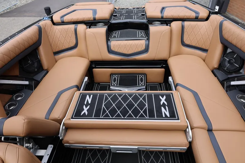Slide: The Image of Luxurious interior of 2021 Tigé 23ZX boat with tan leather seating and stylish design. - 26