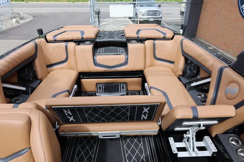 Slide: The Image of Luxurious interior of 2021 Tigé 23ZX boat with tan leather seating and modern design. - 28