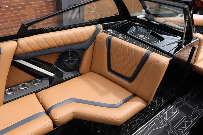 Slide: The Image of Luxurious interior of 2021 Tigé 23ZX boat with tan leather seating and modern design. - 29