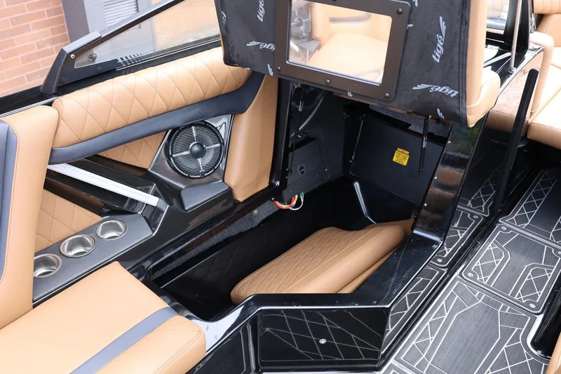 Slide: The Image of Interior of 2021 Tigé 23ZX boat with tan seating and cup holders. - 30