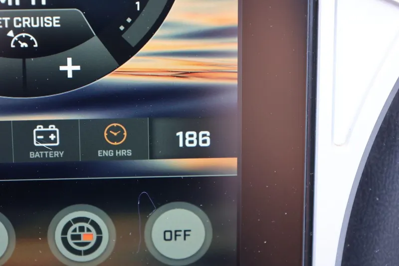 Slide: The Image of Dashboard display of a 2021 Tigé 23ZX boat showing engine hours and battery status. - 36
