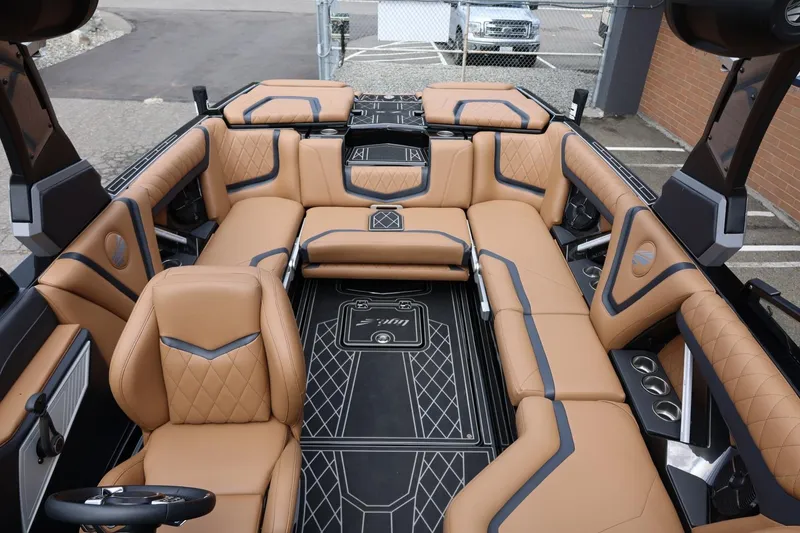 Slide: The Image of 2021 Tigé 23ZX boat interior with luxurious tan seating and modern design. - 40