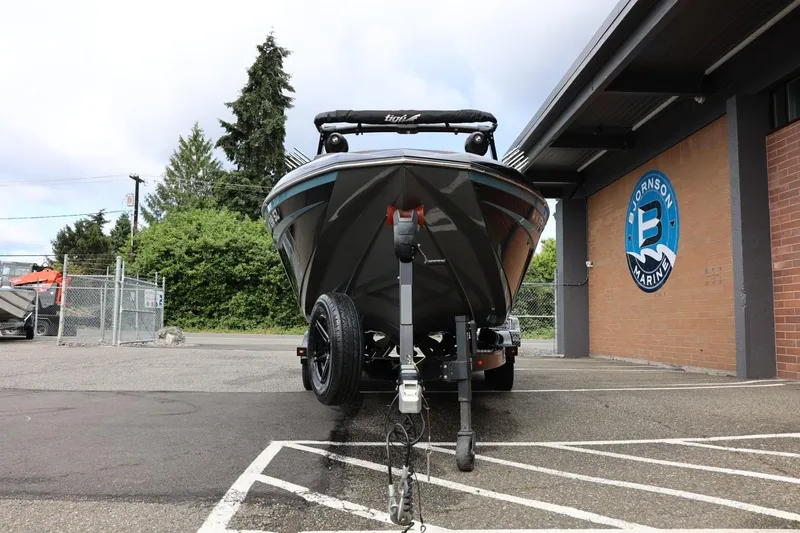 Slide: The Image of 2021 Tigé 23ZX boat on trailer at dealership, front view. - 6