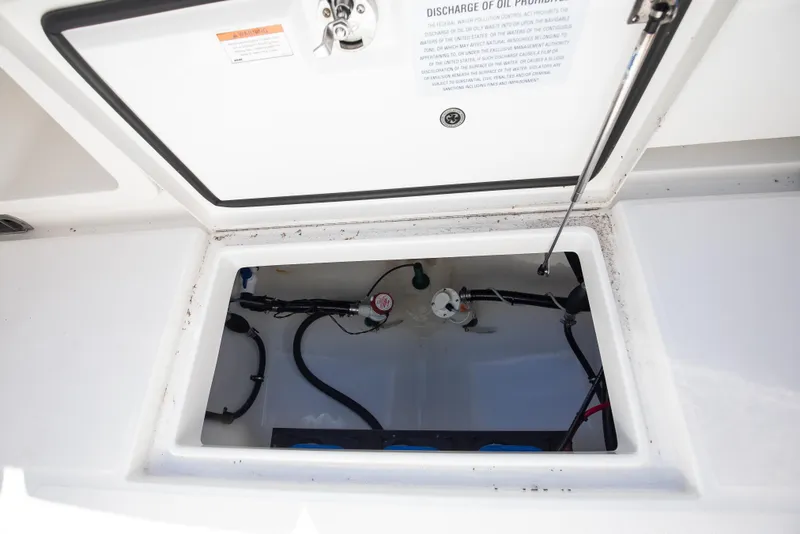 Slide: The Image of Open storage compartment on 2022 Regulator 28 Forward Seating boat. - 15