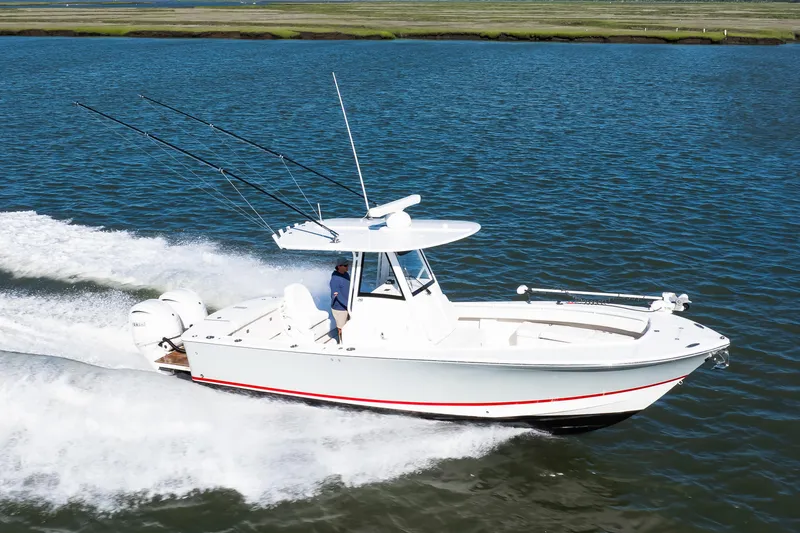 Slide: The Image of 2022 Regulator 28 Forward Seating boat cruising on open water. - 21