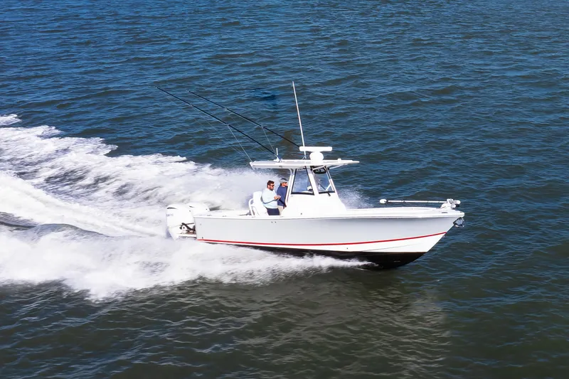 Slide: The Image of 2022 Regulator 28 Forward Seating boat cruising on open water. - 5