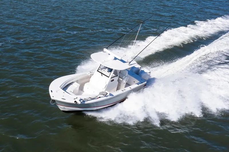 Slide: The Image of 2022 Regulator 28 Forward Seating boat cruising on open water. - 19