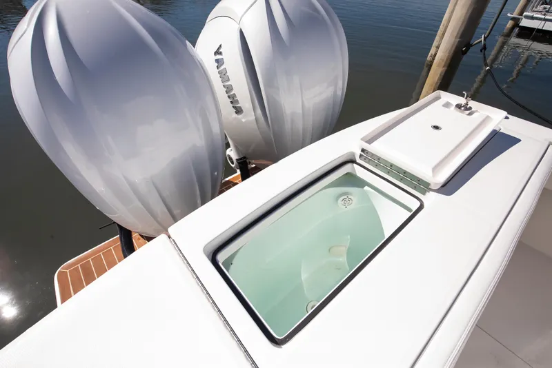 Slide: The Image of 2022 Regulator 28 Forward Seating boat with Yamaha engines and onboard sink. - 17