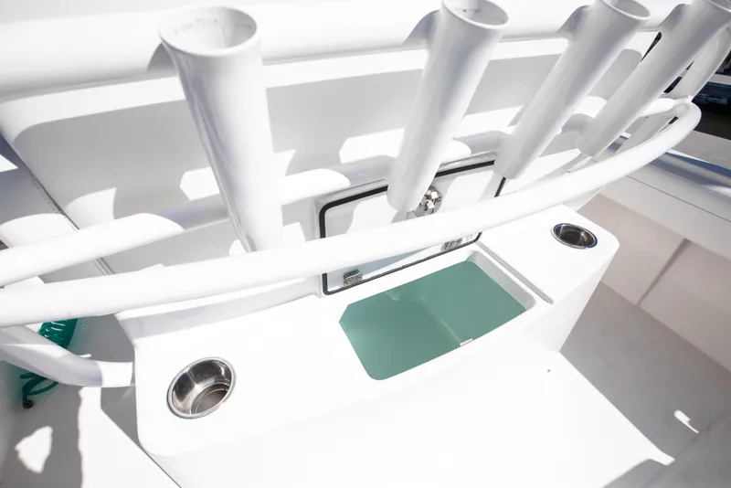 Slide: The Image of 2022 Regulator 28 Forward Seating boat with rod holders and storage compartment. - 16