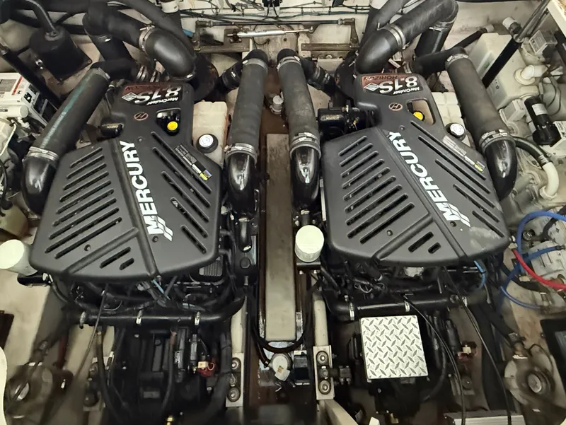 Slide: The Image of The engine room of a 2007 Sea Ray 340 Sundancer with two Mercury engines. - 33