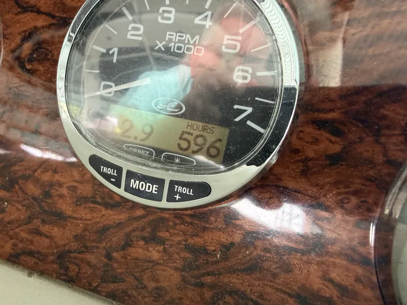 Slide: The Image of Close-up of a boat tachometer showing 596 operating hours. - 11