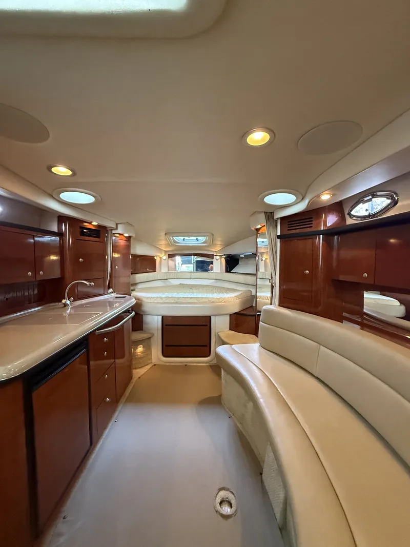 Slide: The Image of Interior of a 2007 Sea Ray 340 Sundancer with elegant wood paneling and comfortable seating. - 21