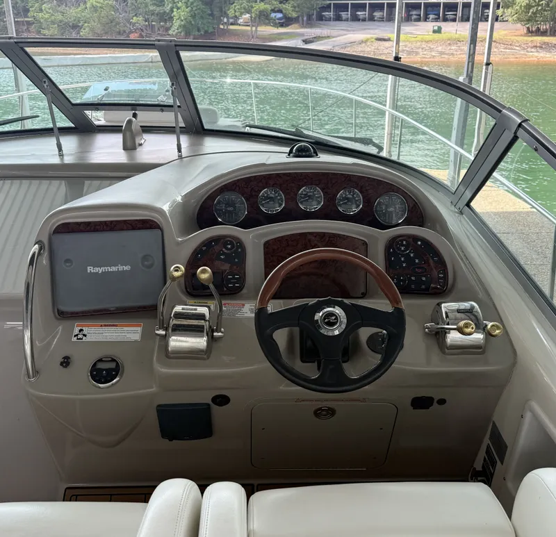 Slide: The Image of The image shows the helm of a 2007 Sea Ray 340 Sundancer with a Raymarine display. - 9