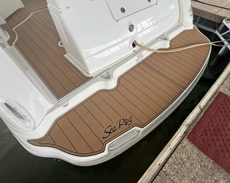 Slide: The Image of The swim platform of a 2007 Sea Ray 340 Sundancer with brown decking. - 35