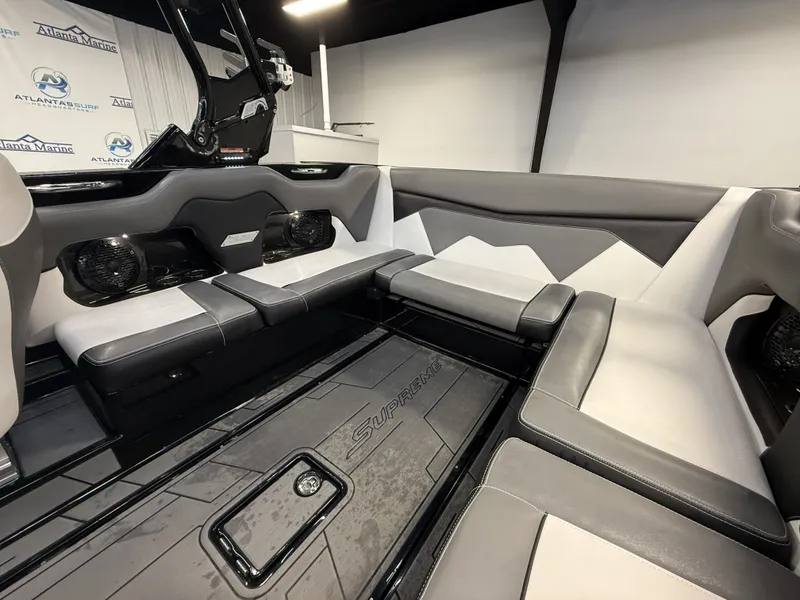 Slide: The Image of Interior of a 2020 Supreme ZS 232 boat with gray and white seating. - 11