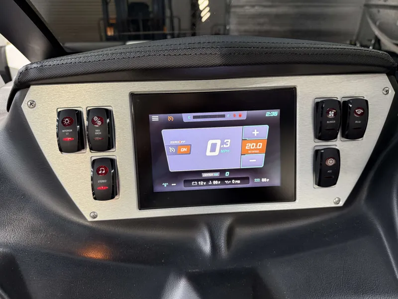 Slide: The Image of Dashboard of a Supreme ZS 232 boat with digital display and switches. - 20
