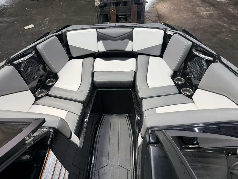 Slide: The Image of Interior of a Supreme ZS 232 boat with gray and white seating. - 23