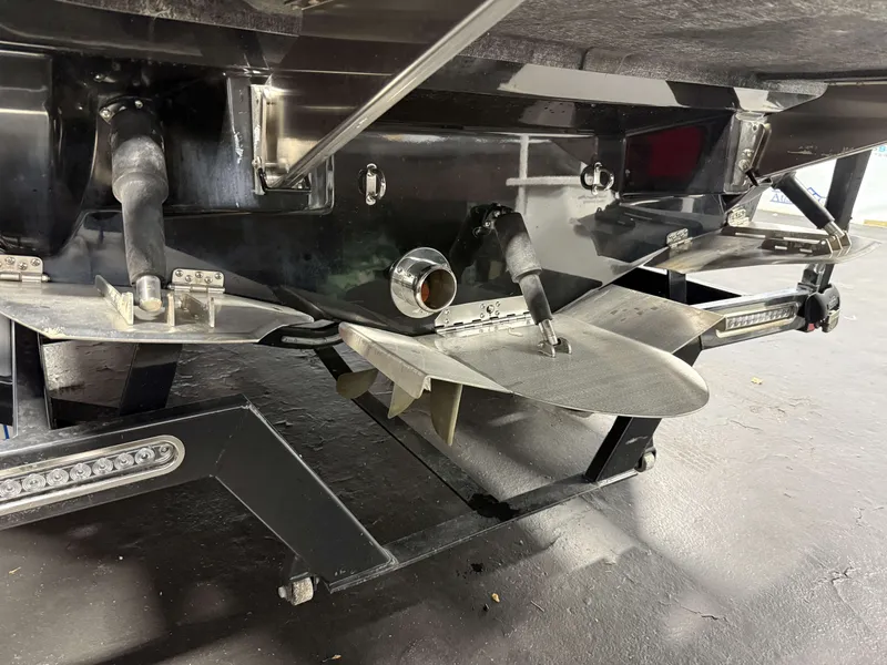 Slide: The Image of Close-up of the propeller and underside of a 2020 Supreme ZS 232 boat. - 27