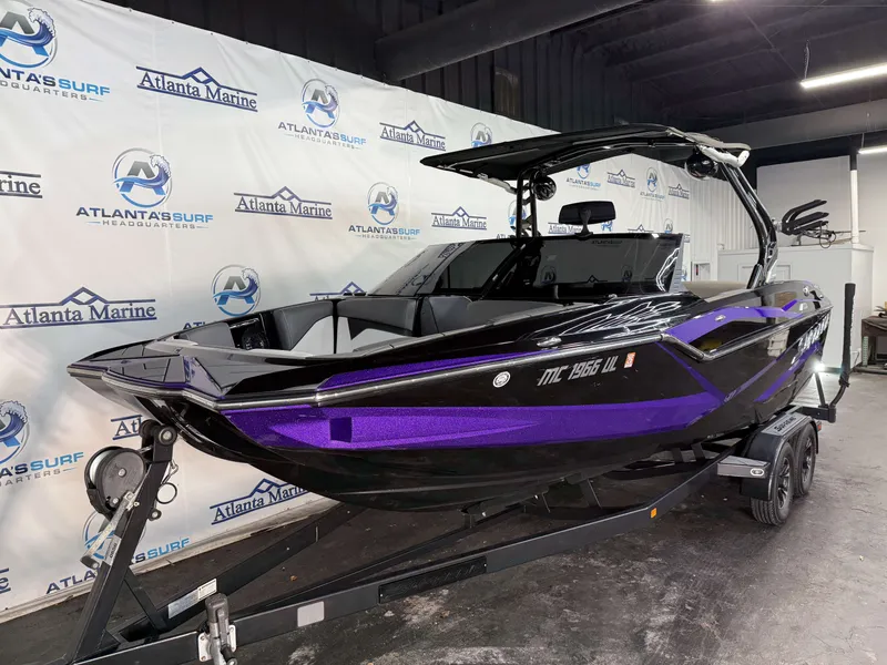 Slide: The Image of A 2020 Supreme ZS 232 boat in black and purple on a trailer in a showroom. - 4
