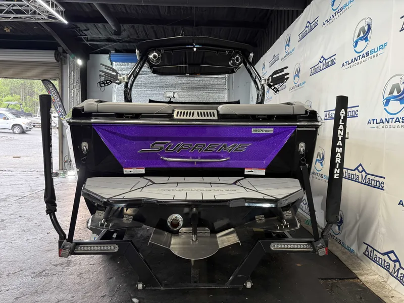 Slide: The Image of Rear view of a 2020 Supreme ZS 232 boat in a workshop. - 5