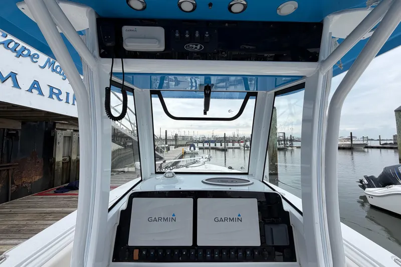 Slide: The Image of 2020 Sea Hunt Ultra 275 SE boat dashboard with Garmin navigation at marina. - 10