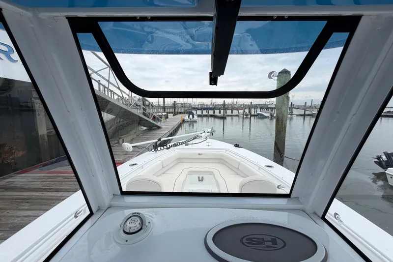 Slide: The Image of 2020 Sea Hunt Ultra 275 SE boat interior view at marina dock. - 11