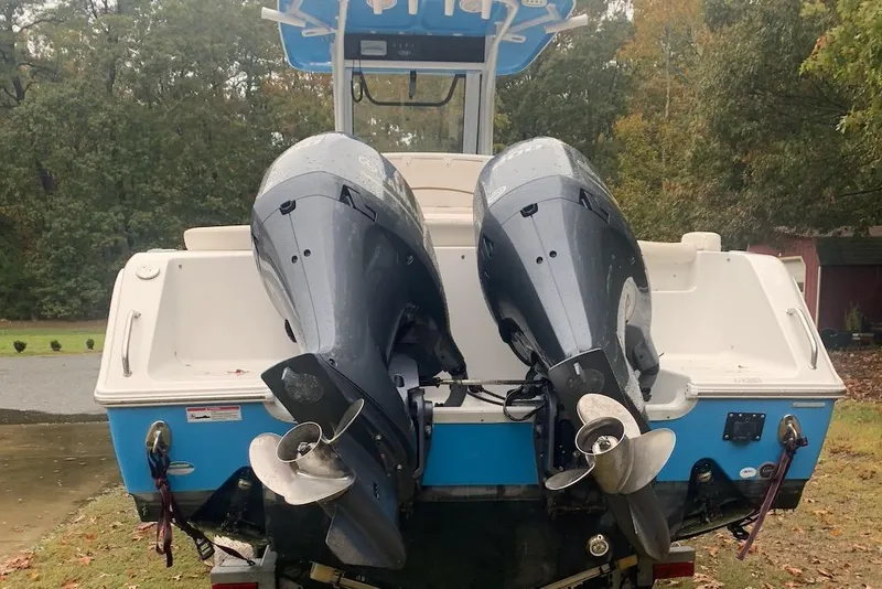 Slide: The Image of 2020 Sea Hunt Ultra 275 SE boat with dual outboard motors. - 17