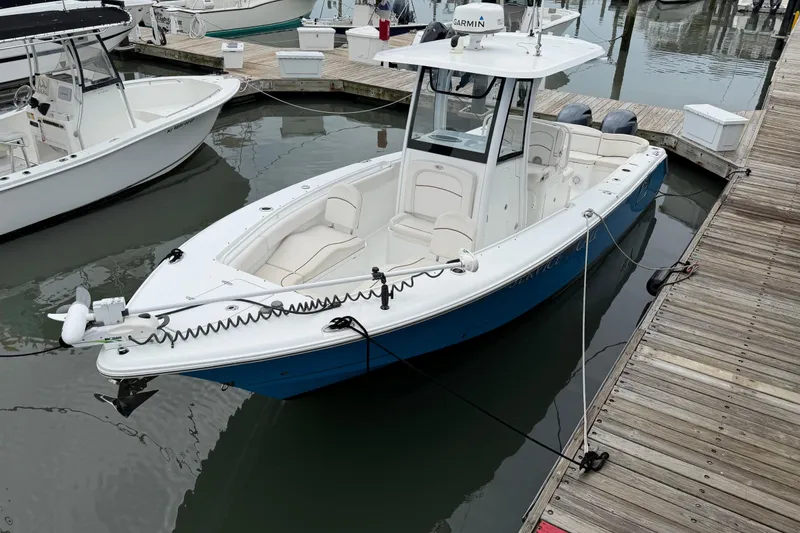 Slide: The Image of 2020 Sea Hunt Ultra 275 SE boat docked in marina, featuring sleek design and modern equipment. - 3