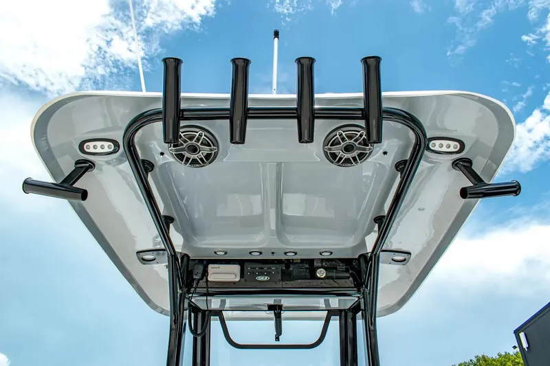Slide: The Image of View of a Sea Hunt Gamefish 25 T-top with speakers and rod holders. - 14