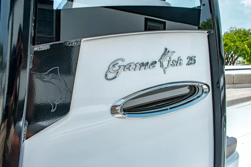 Slide: The Image of Close-up of the Sea Hunt Gamefish 25 with stylish logo and sleek details. - 20