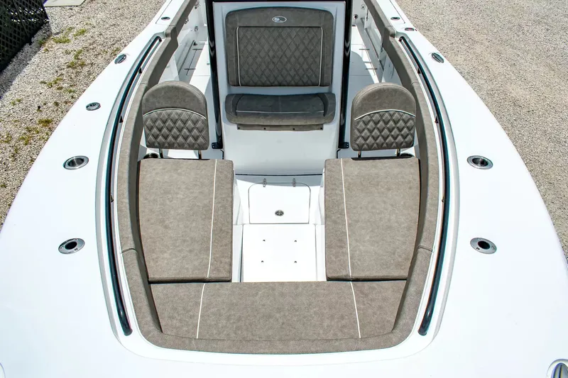 Slide: The Image of The image shows the bow of a Sea Hunt Gamefish 25 boat with cushioned seating. - 21