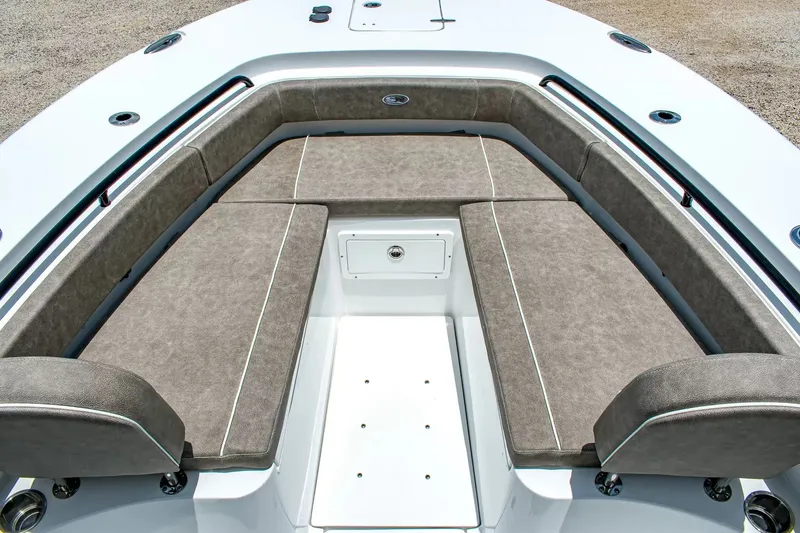Slide: The Image of Front seating area of a Sea Hunt Gamefish 25 boat with cushioned seats and storage. - 25