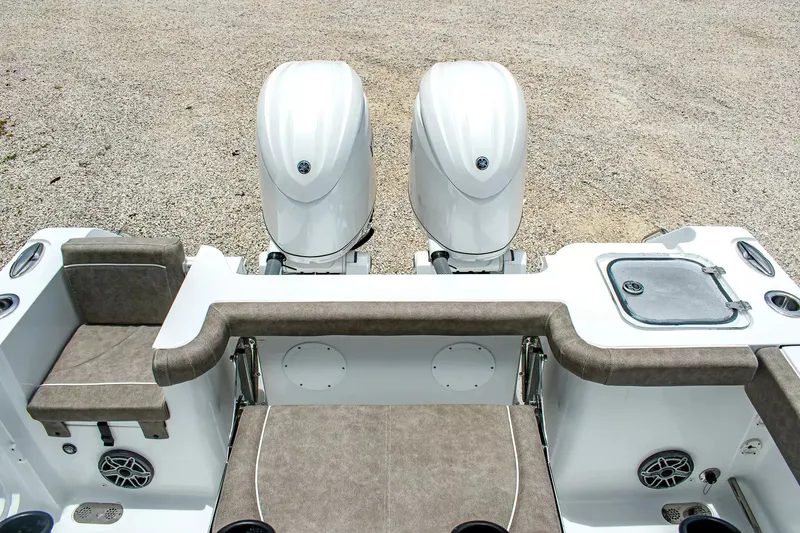 Slide: The Image of The image shows the stern of a Sea Hunt Gamefish 25 with two outboard engines. - 9