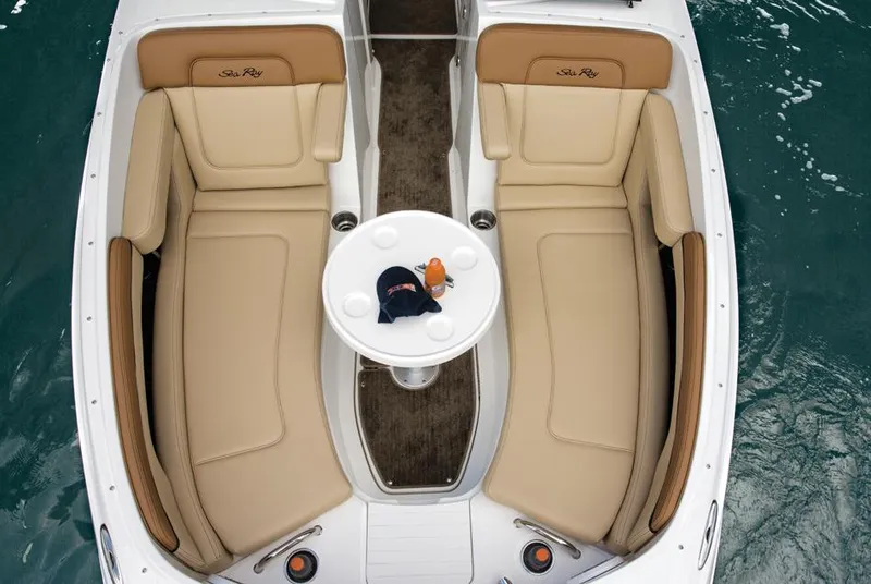 Slide: The Image of Manufacturer Provided Image: 2014 Sea Ray 260 Sundeck boat interior with tan seating and round table. - 17