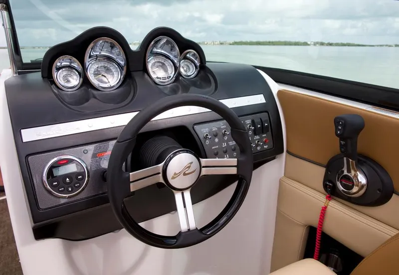 Slide: The Image of Manufacturer Provided Image: 2014 Sea Ray 260 Sundeck helm with steering wheel and control panel. - 18