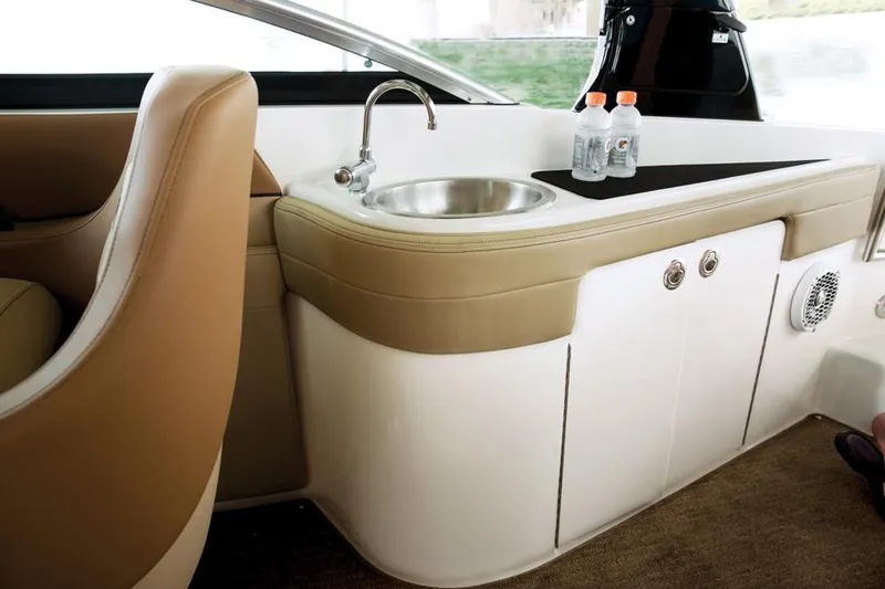 Slide: The Image of Manufacturer Provided Image: Interior of 2014 Sea Ray 260 Sundeck with sink and storage compartments. - 19