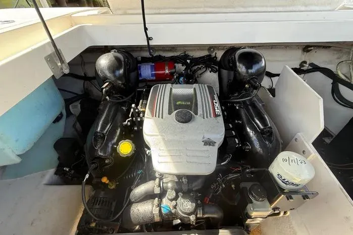 Slide: The Image of Engine compartment of a 2014 Sea Ray 260 Sundeck boat, featuring a MerCruiser engine. - 7