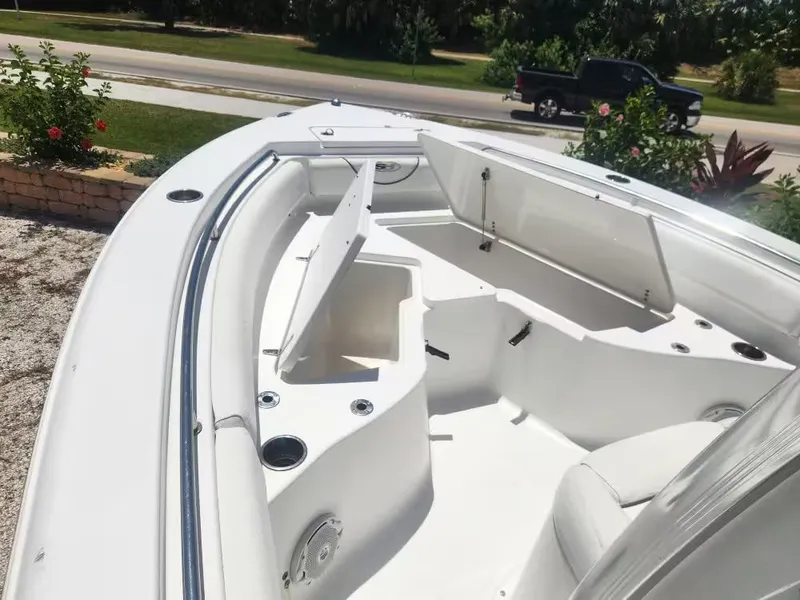 Slide: The Image of The image shows the bow of a 2017 Sea Hunt Ultra 255 SE boat with seating and storage. - 10