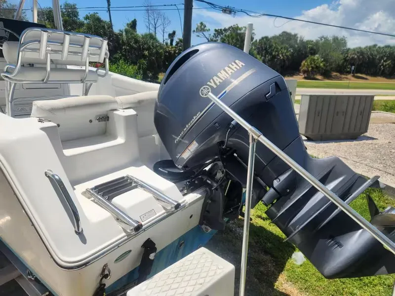 Slide: The Image of A 2017 Sea Hunt Ultra 255 SE with a Yamaha outboard motor, parked on a trailer. - 3