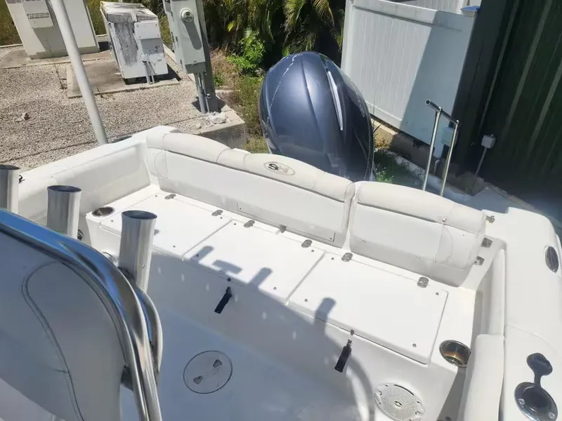 Slide: The Image of The image shows the stern of a 2017 Sea Hunt Ultra 255 SE boat with an outboard motor. - 4