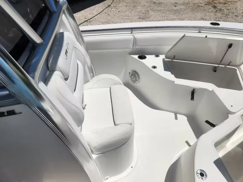 Slide: The Image of The image shows the bow area of a 2017 Sea Hunt Ultra 255 SE boat with white upholstery. - 9