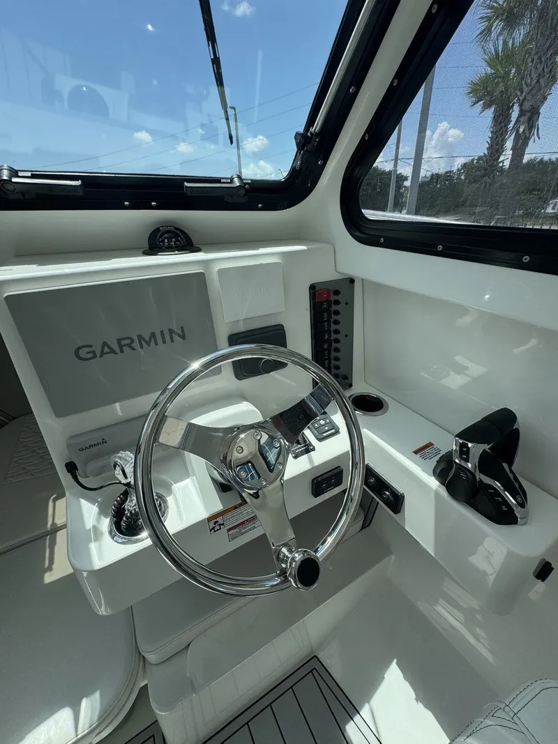 Slide: The Image of The cockpit of the Parker 247 Explorer features a modern steering wheel and Garmin navigation. - 15