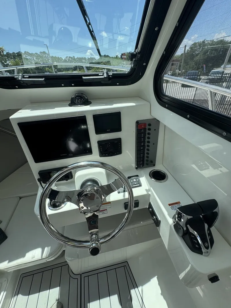 Slide: The Image of Interior view of a 2027 Parker 247 Explorer helm with modern electronics. - 19