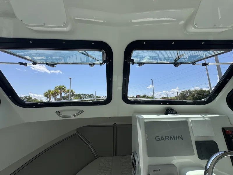 Slide: The Image of Interior view of a Parker 247 Explorer with large windows and a Garmin navigation system. - 21