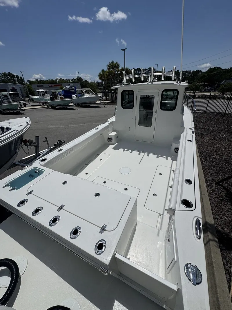 Slide: The Image of Parker 247 Explorer 2027 on a lot with other boats in the background. - 7